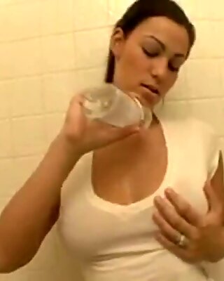 young adults rubs her hugh boobs with gas
